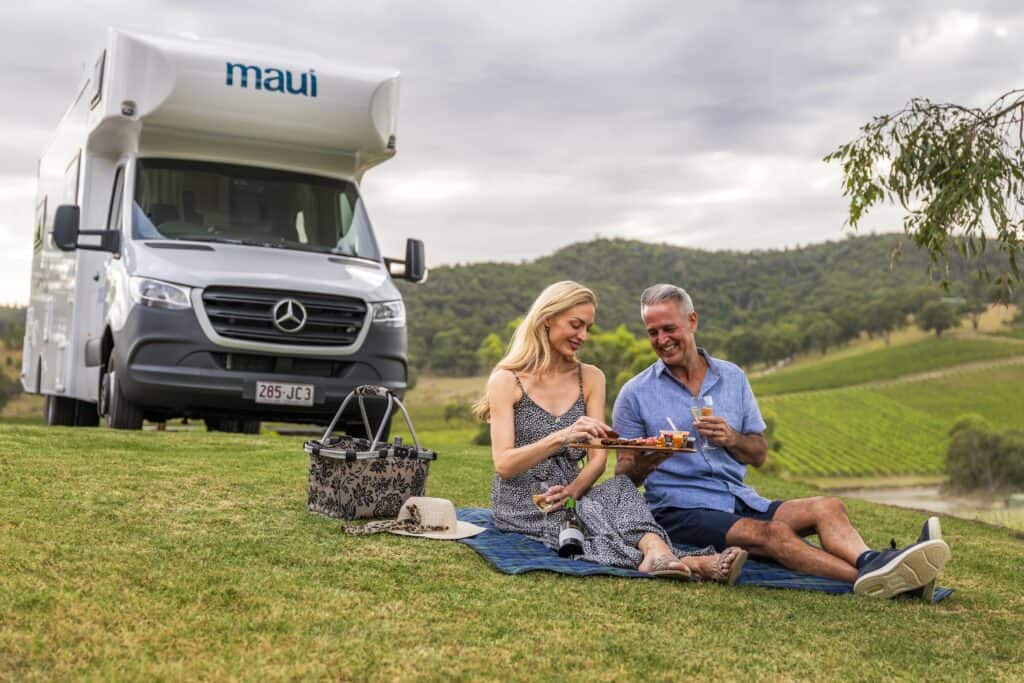 couple in a campervan - sustainable travel